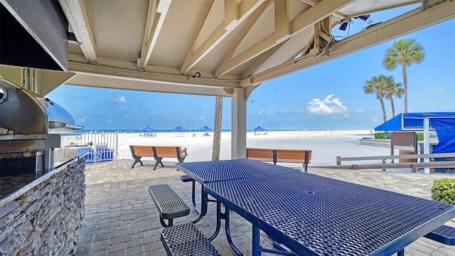 5920 Midnight Pass Rd Unit 406, Sarasota, FL 34242 - view of patio featuring view of water and beach and outdoor dining space