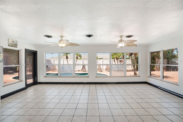 unfurnished sunroom featuring visible vents