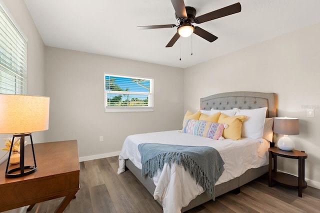 bedroom with baseboards, a ceiling fan, and wood finished floors
