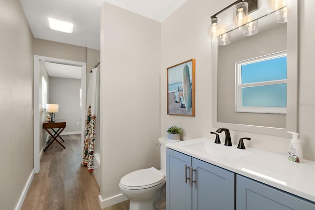 full bathroom featuring shower / bath combination with curtain, vanity, toilet, and wood finished floors