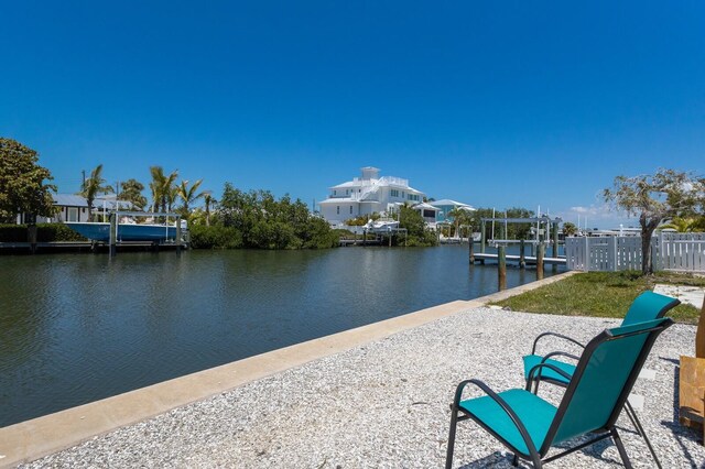 dock area featuring a water view and boat lift