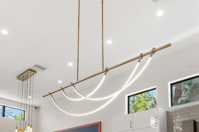details featuring visible vents and recessed lighting