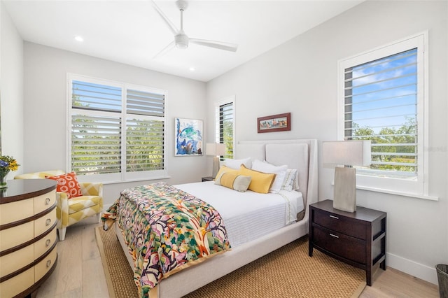 bedroom with light wood finished floors, baseboards, recessed lighting, and ceiling fan
