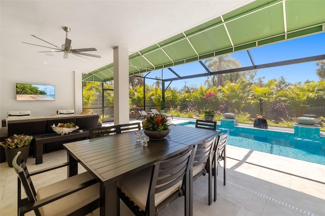 sunroom featuring a pool, plenty of natural light, a ceiling fan, and an outdoor living space