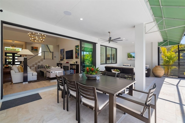 view of patio / terrace featuring outdoor dining area, an outdoor living space, and ceiling fan