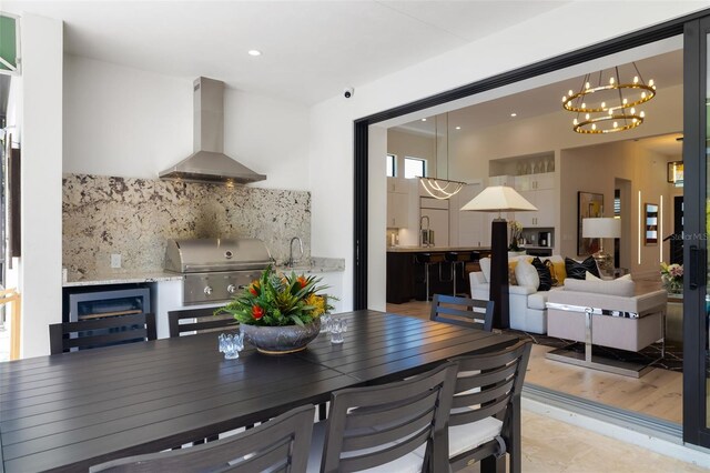 dining space featuring recessed lighting and a notable chandelier