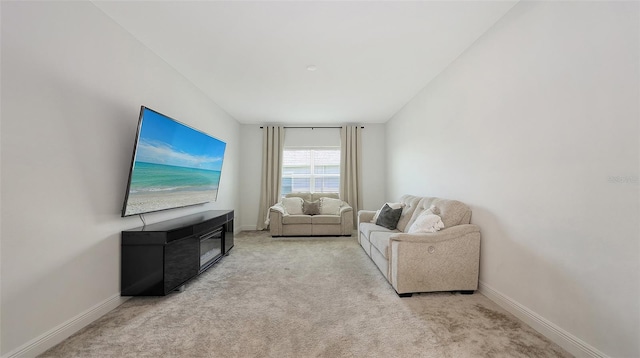 living room featuring baseboards and carpet flooring