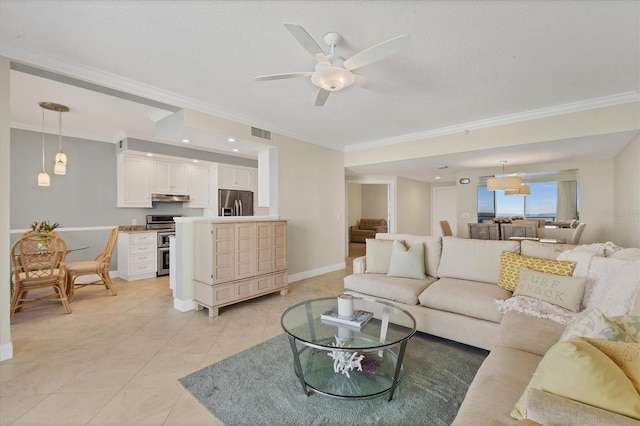 living room with a ceiling fan, visible vents, crown molding, light tile patterned floors, and baseboards