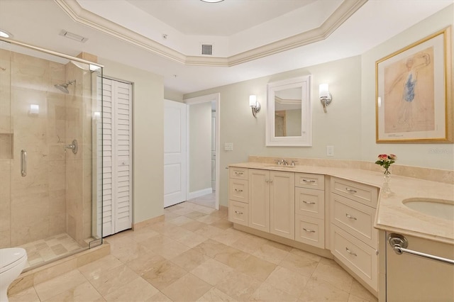 bathroom featuring a sink, a shower stall, double vanity, and visible vents