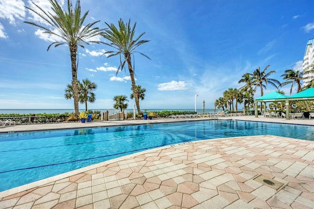 pool with a patio and a gazebo