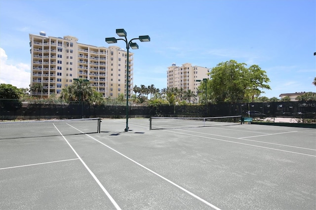 view of sport court with fence