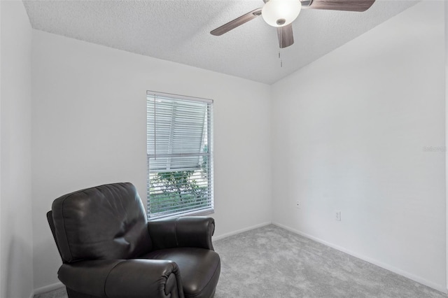5382 Royal Palm Ave Unit 5382, Sarasota, FL 34234 - living area featuring carpet floors, a textured ceiling, ceiling fan, and baseboards