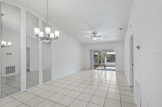 5382 Royal Palm Ave Unit 5382, Sarasota, FL 34234 - unfurnished room featuring a chandelier, ceiling fan, light tile patterned floors, and a textured ceiling