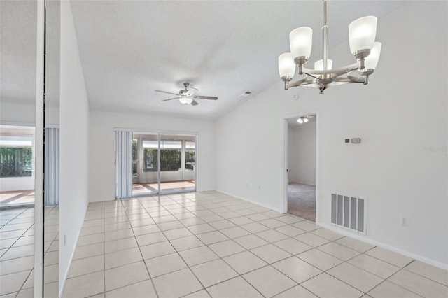 5382 Royal Palm Ave Unit 5382, Sarasota, FL 34234 - empty room featuring ceiling fan, a chandelier, light tile patterned flooring, and a textured ceiling