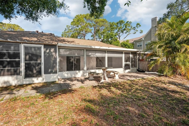 5382 Royal Palm Ave Unit 5382, Sarasota, FL 34234 - back of house featuring a sunroom and a patio area