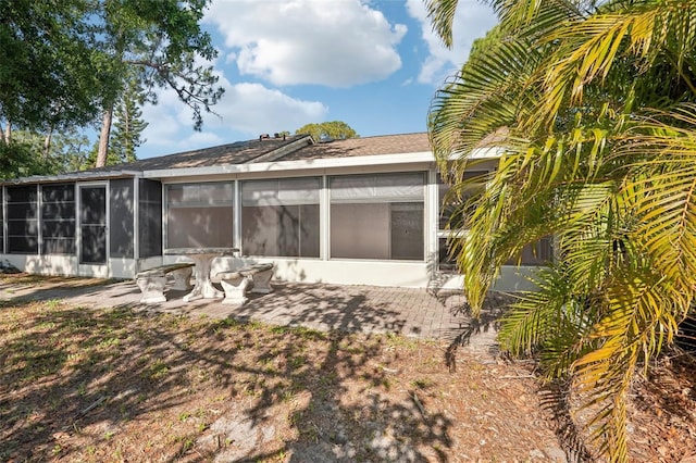 5382 Royal Palm Ave Unit 5382, Sarasota, FL 34234 - back of property with a sunroom and a patio area