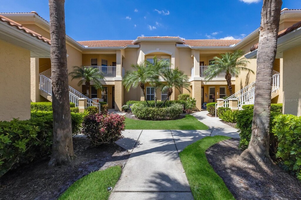 7155 Boca Grove Pl Unit 102, Lakewood Ranch, FL 34202 - exterior space featuring stucco siding and a tile roof