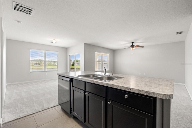 14914 Flowing Gold Dr, Bradenton, FL 34212 - kitchen with light colored carpet, stainless steel dishwasher, open floor plan, a sink, and a kitchen island with sink