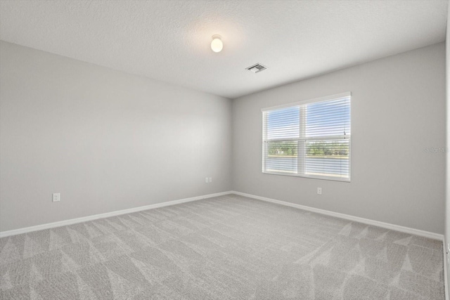 14914 Flowing Gold Dr, Bradenton, FL 34212 - empty room with carpet flooring, baseboards, and a textured ceiling