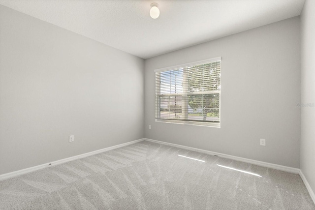 14914 Flowing Gold Dr, Bradenton, FL 34212 - empty room featuring carpet floors and baseboards