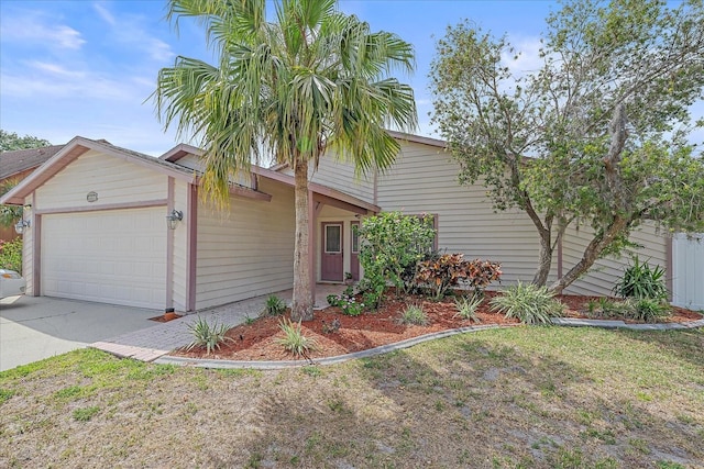 4053 Lancaster Dr, Sarasota, FL 34241 - view of front of home featuring an attached garage and driveway