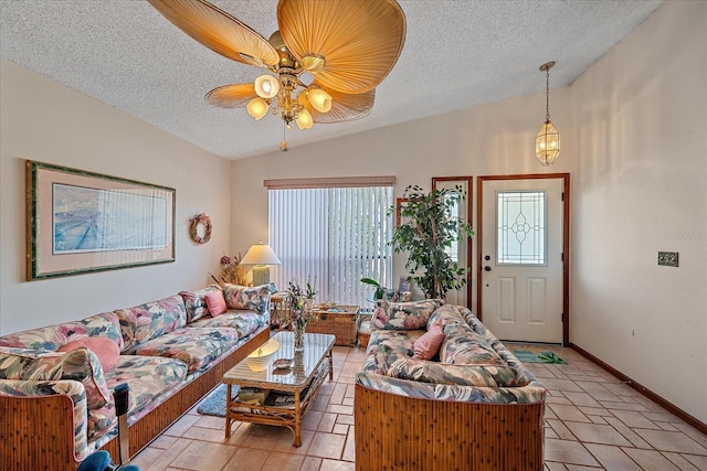 4053 Lancaster Dr, Sarasota, FL 34241 - living area featuring vaulted ceiling, a textured ceiling, baseboards, and ceiling fan