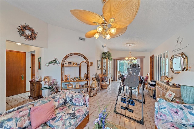 4053 Lancaster Dr, Sarasota, FL 34241 - bedroom with ceiling fan with notable chandelier, vaulted ceiling, visible vents, and a textured ceiling