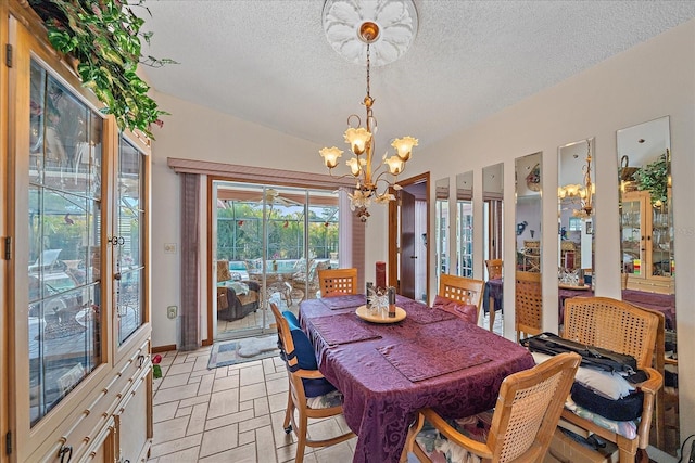 4053 Lancaster Dr, Sarasota, FL 34241 - dining area with vaulted ceiling, a textured ceiling, and a notable chandelier