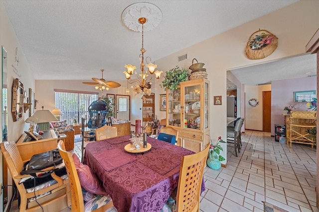 4053 Lancaster Dr, Sarasota, FL 34241 - dining space featuring ceiling fan with notable chandelier, visible vents, and a textured ceiling