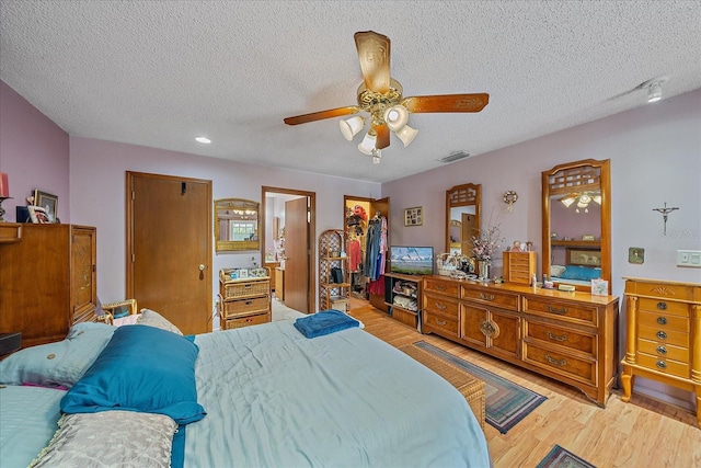 4053 Lancaster Dr, Sarasota, FL 34241 - bedroom with light wood finished floors, visible vents, a textured ceiling, and a closet