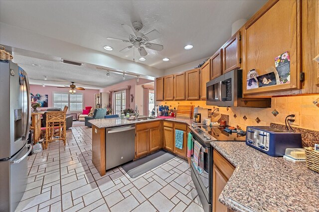 4053 Lancaster Dr, Sarasota, FL 34241 - kitchen featuring stainless steel appliances, a ceiling fan, visible vents, and a peninsula