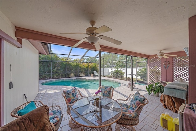 4053 Lancaster Dr, Sarasota, FL 34241 - view of swimming pool with glass enclosure, a ceiling fan, a fenced in pool, and a patio
