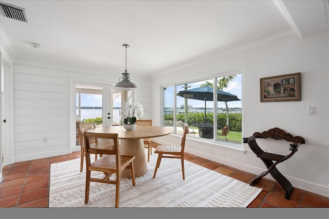 dining space featuring crown molding, french doors, tile patterned floors, and baseboards