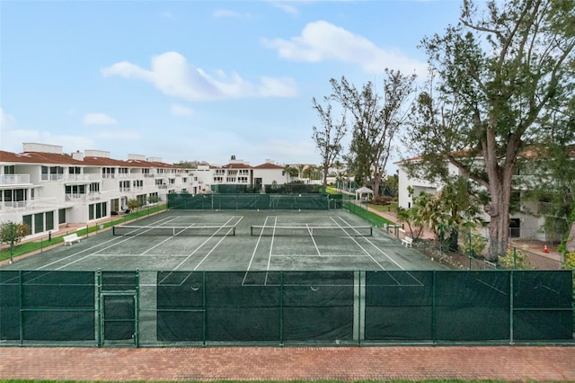 view of tennis court with fence