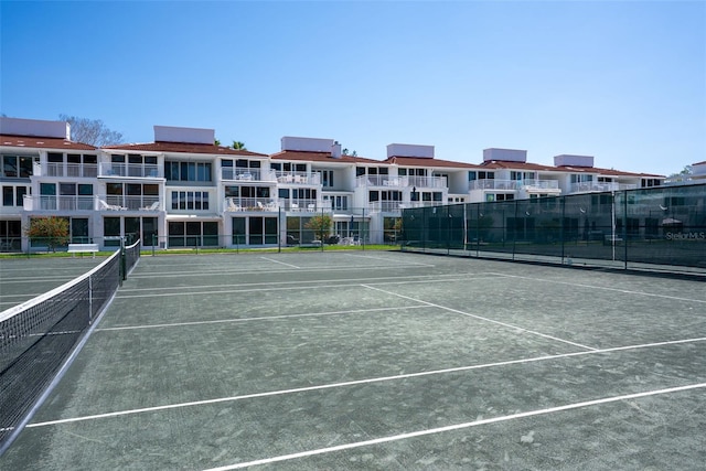 view of sport court featuring fence