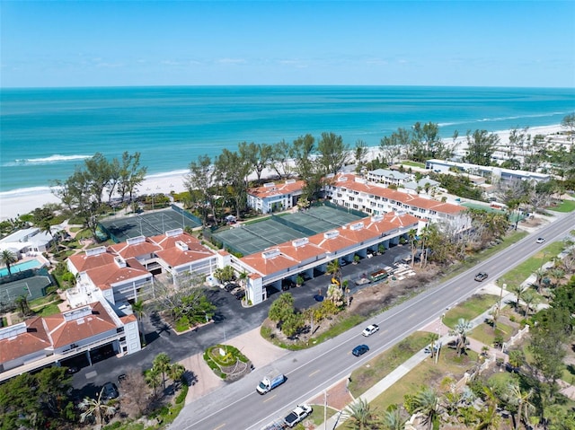 bird's eye view with a beach view and a water view