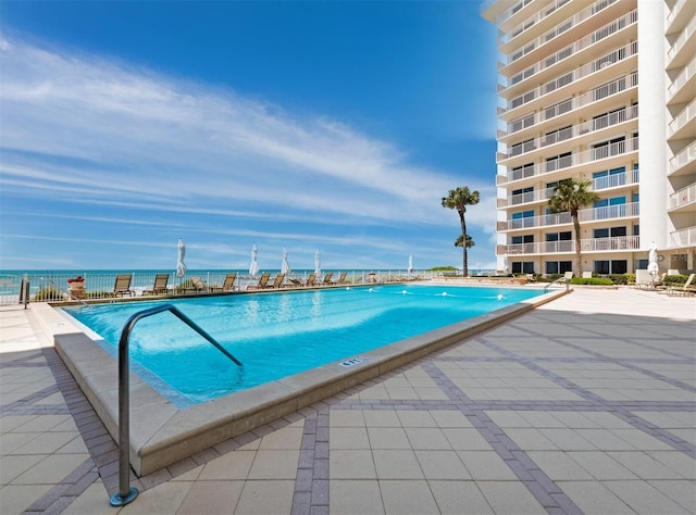 community pool featuring a patio area