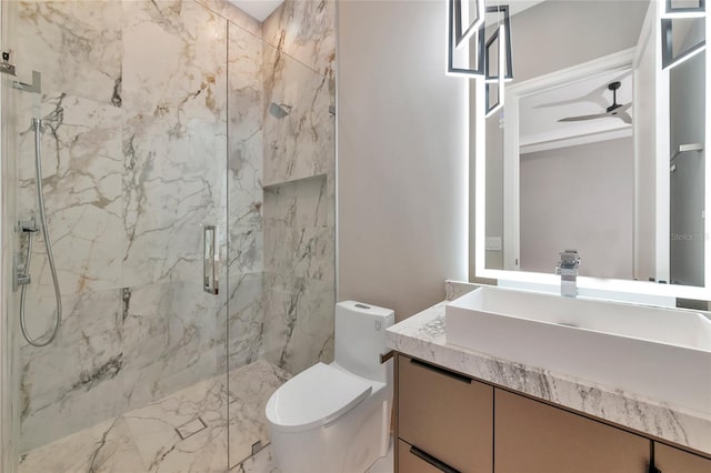 bathroom with toilet, vanity, and a marble finish shower