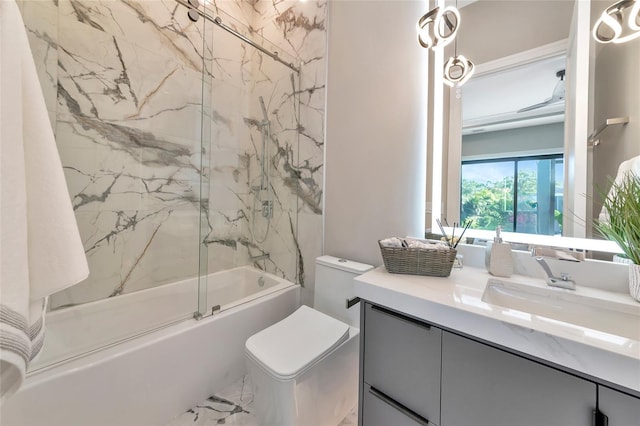 full bath featuring shower / bath combination with glass door, toilet, and vanity