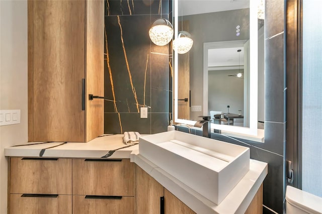 bathroom featuring vanity and toilet