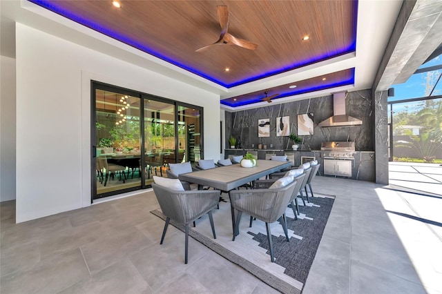 view of patio / terrace featuring grilling area, outdoor dining space, an outdoor kitchen, and ceiling fan