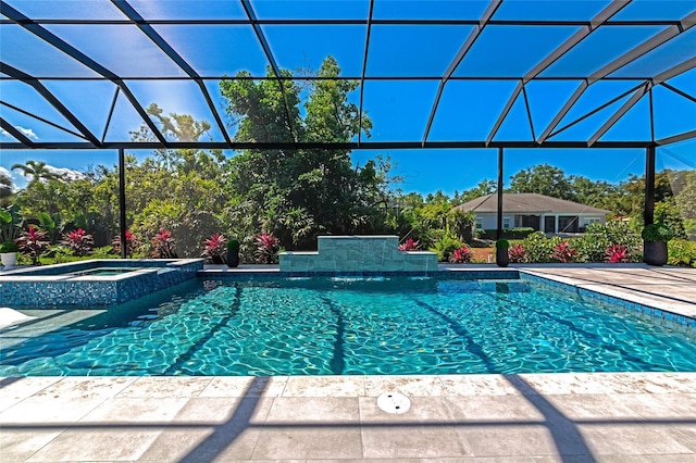 view of pool with a patio area and a pool with connected hot tub