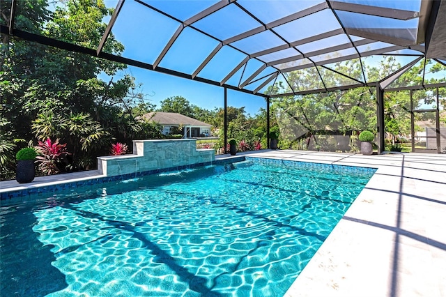 outdoor pool featuring a lanai and a patio area
