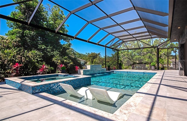 view of swimming pool with glass enclosure, a patio area, and a pool with connected hot tub