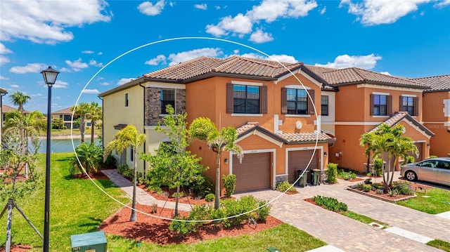20398 Lagente Cir, Venice, FL 34293 - view of front of property with a front lawn, stucco siding, a tile roof, driveway, and a garage