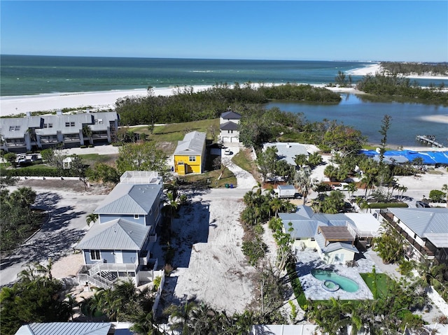 aerial view featuring a water view and a view of the beach