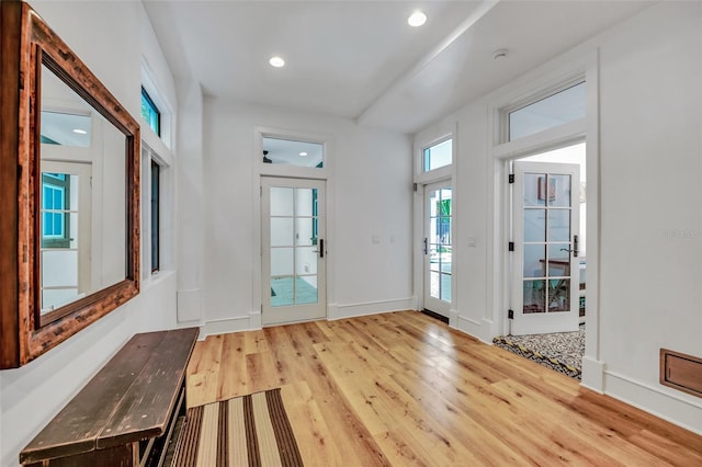 103 Park Ave, Anna Maria, FL 34216 - doorway to outside featuring light wood-type flooring, baseboards, and recessed lighting