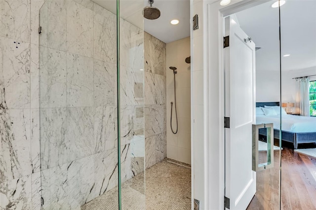 103 Park Ave, Anna Maria, FL 34216 - full bath featuring a tile shower, wood finished floors, and ensuite bath
