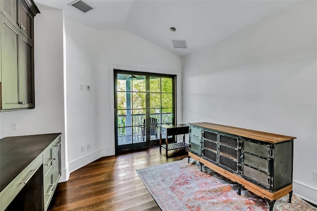 103 Park Ave, Anna Maria, FL 34216 - interior space with baseboards, vaulted ceiling, visible vents, and dark wood-style floors