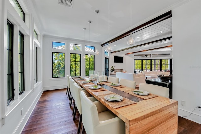 103 Park Ave, Anna Maria, FL 34216 - dining space featuring dark wood-style flooring, a ceiling fan, baseboards, ornamental molding, and visible vents